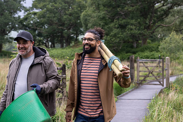 istock Male Friends Participating in Environmental Restoration 2222888784