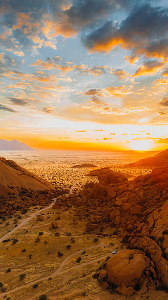 istock Aerial View of Awe-Inspiring Sunset Above Car Camping in Spitzkoppe Cliffs, Namibia 2222889052
