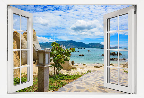 istock Window with a view of the ocean and a beach 2222889070