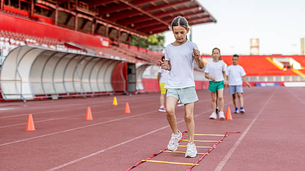 istock Children Practicing Agility Drills on a Sports Field During Training 2222891801