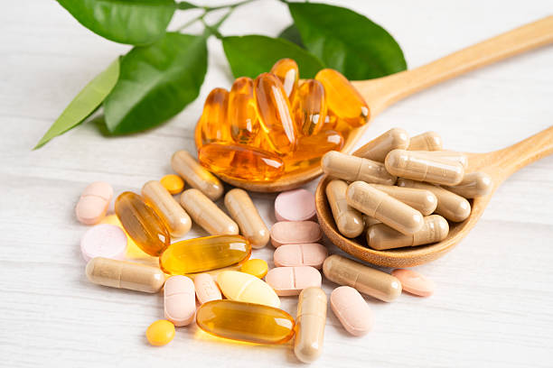 istock Alternative medicine herbal organic capsule drug herb. 2222892418