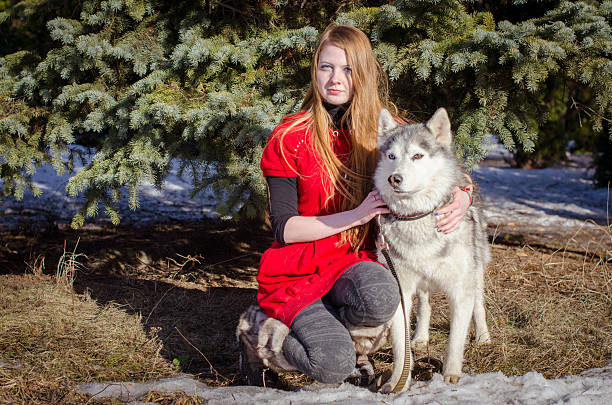young woman with husky winter walk outdoors friendship winter holidays. High quality photo