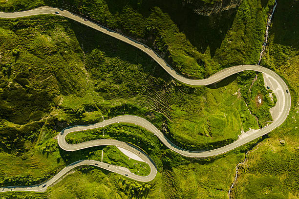 istock Winding mountain road through green landscape 2222893813