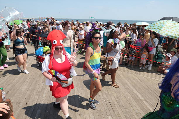 People gather on the boardwalk on the final stretch of the Mermaid Parade on Surf Avenue in Coney Island, N.Y., Saturday, June 21, 2025.