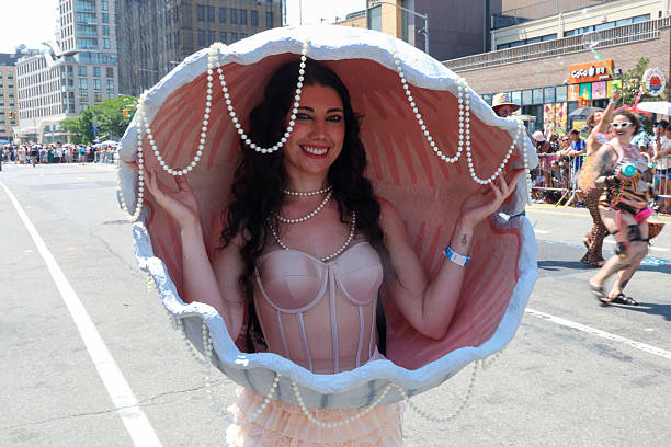 Brandi Monard looks great dressed as a calm shell participates in the Mermaid Parade on Surf Avenue in Coney Island, N.Y., Saturday, June 21, 2025.