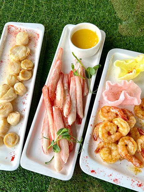 Crab legs, scallops and shrimps plate with rice crackers