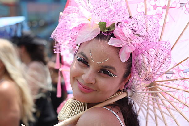 A performer is all smiles for the camera while marching during the Mermaid Parade on Surf Avenue in Coney Island, N.Y., Saturday, June 21, 2025.