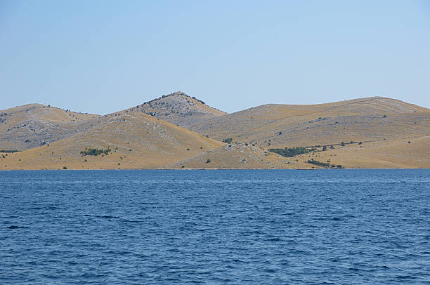 Kornati Islands boat point of view against blue sky.