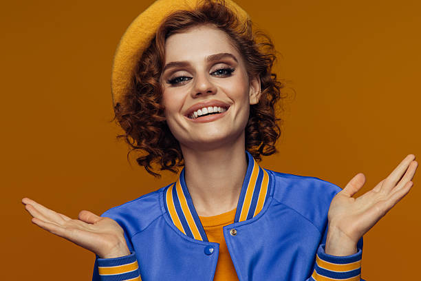 istock Carefree Confidence: Woman Smiling in a Bright Outfit 2222898248