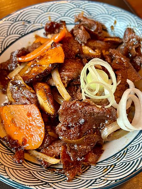 istock Beef stir-fry with onions and orange peppers 2222898847