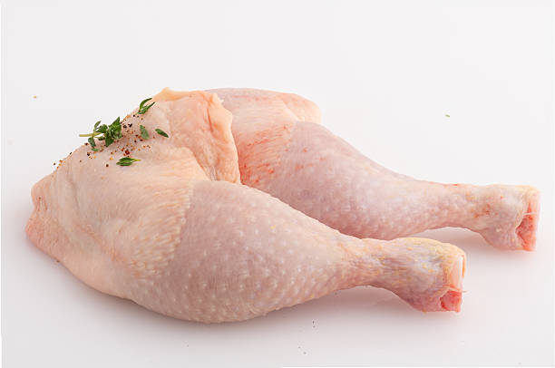 istock Fresh chicken legs with chili flakes isolated nature background with clipping path 2222900737