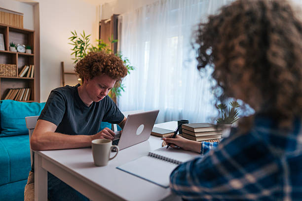 istock Young adults studying together at home 2222902447
