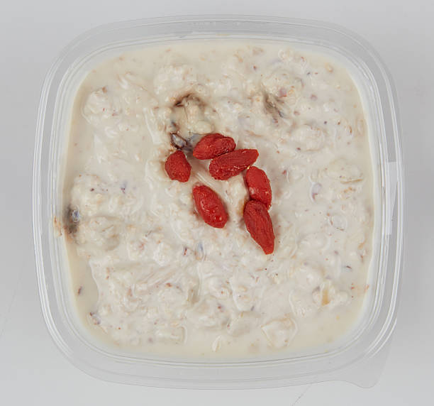 Mayonnaise salad in a plastic box isolated nature background with clipping path