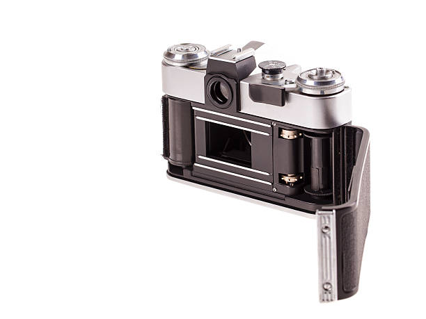 Old metal photo camera. Isolated on a white background.