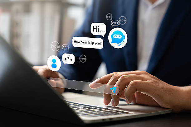 istock Businessman interacts with AI chatbot on laptop, Automated conversations in digital business. Concept includes virtual support, Customer communication, Smart service through artificial intelligence. 2222907940