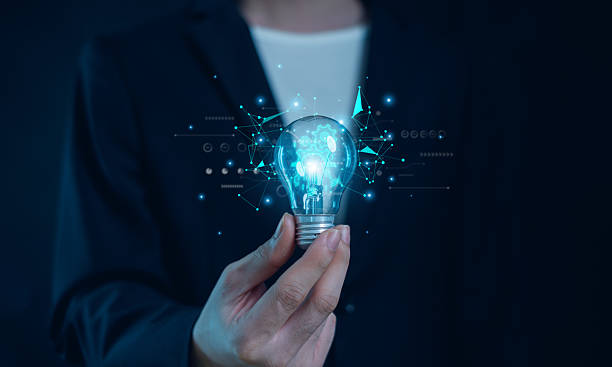 istock Hand of  holding illuminated light bulb, Idea innovation and inspiration concept.  creativity with bulbs that shine glitter, Concept for success. 2222909002