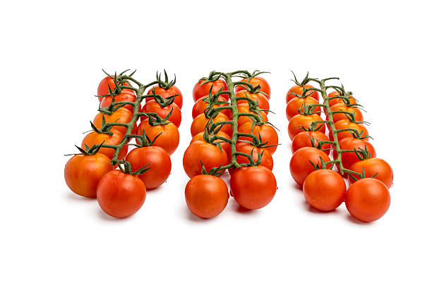istock Three tomato branches next to each other. 2222910244