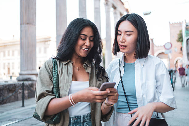 istock Tourists using smartphone and enjoying sightseeing in milan, italy 2222911209