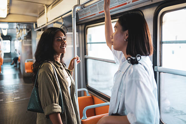 istock Two tourists talking while standing on a tram in milan 2222911266