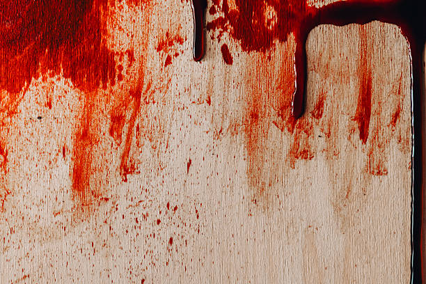 istock Bloody texture. Blood Dripping and Splattering on Wood Surface.Red blood streams 2222912811
