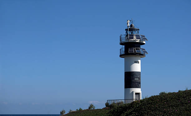 istock Lighthouse in Galicia against the blue sky 2222914653