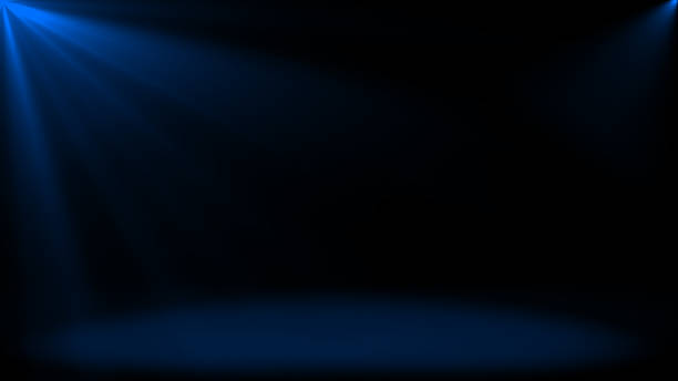 istock Abstract shinny light rays falling on floor, Royal blue optical flares dark background 2222914720