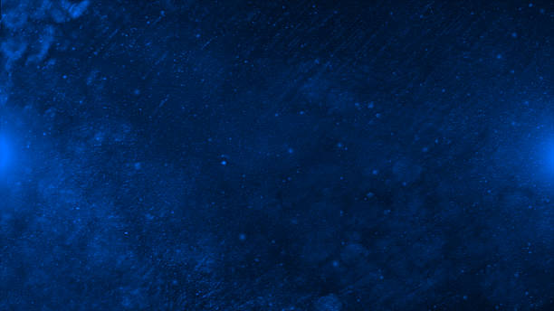 istock abstract design moving dust particles in space, dark galaxy background 2222914805