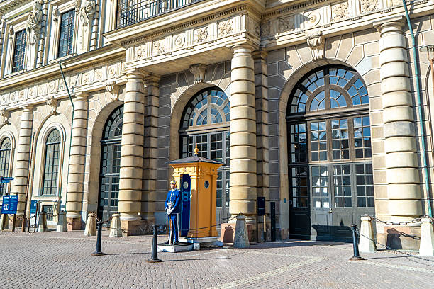 Stockholm, Sweden -  May 30 2025: Blue uniformed guard at the royal palace in Gamla Stan