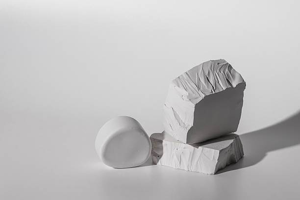 istock Podium of plaster white stones on light background.Minimal empty product presentation demonstration stage. 2222915607