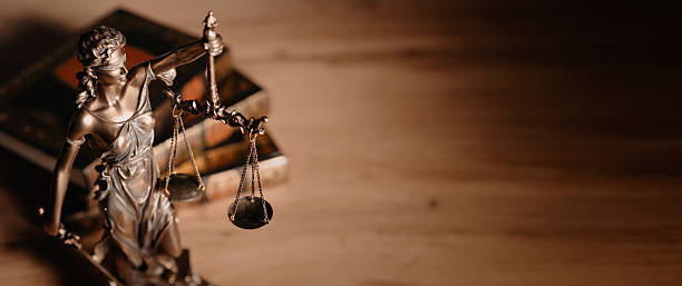 istock Lady Justice figurine on table. Law and justice 2222917822