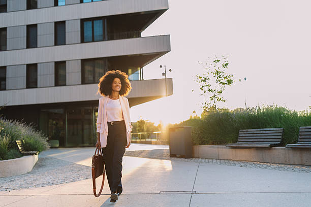 istock Woman Enjoying a Leisurely Walk During Sunset 2222919768