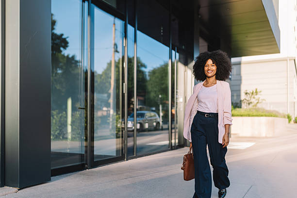 istock Confident woman walking in urban professional setting 2222920113
