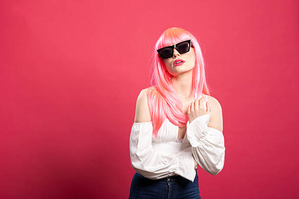 istock Beautiful woman posing with black shades 2222921184