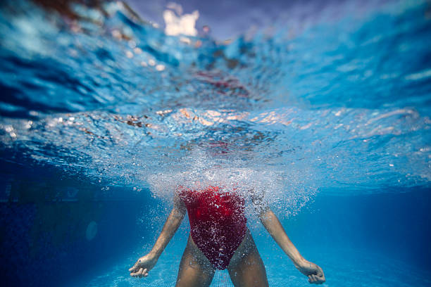 istock Woman Swimming Underwater 2222923067