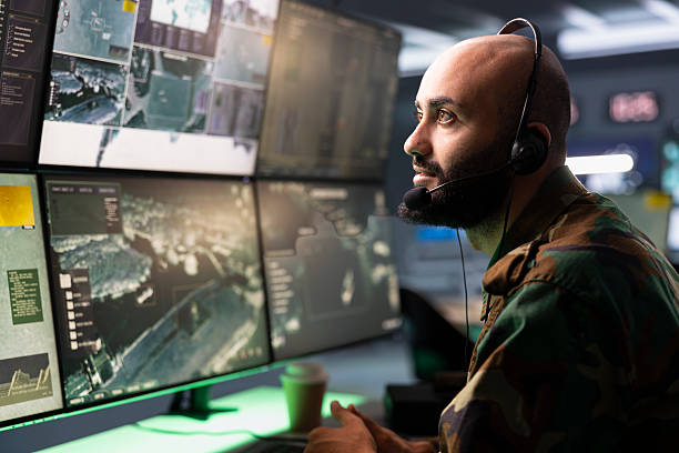 istock Man in camouflage uniform doing satellite communications, talking in mic 2222923440