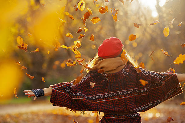 istock Seen from behind woman in red hat rejoicing 2222924604