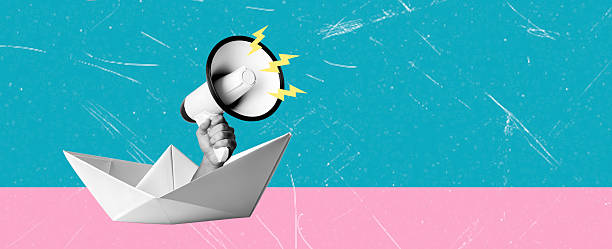 Creative paper boat with a megaphone on a vibrant colored background for expressing ideas and messages