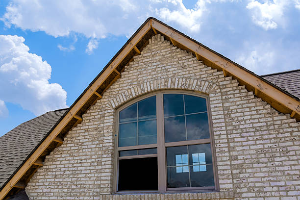 istock House architecture with brick gable large windows under blue sky with clouds during the day 2222925923
