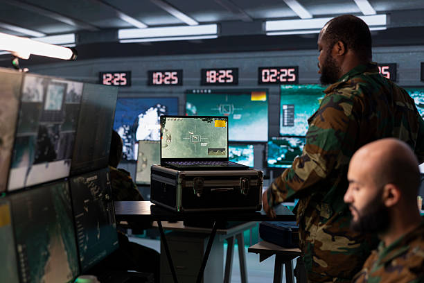 istock Military specialist in base of operations using radar on notebook 2222928201