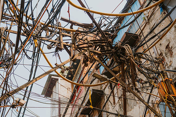 Tangled electricity wires in Old Delhi, India, showcasing urban infrastructure and dynamics.