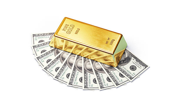 istock $100 Bills with Gold Bullion Bars on them, Object + Shadow Clipping Path 2222928445