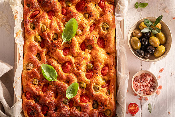 istock Tasty focaccia baked in rectangular baking tray. 2222928467