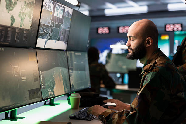 istock Army telecommunication systems operator using radio and satellite gear 2222929866
