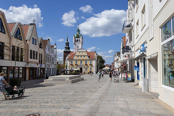 Verden an der Aller, Germany, 28 June 2024: Summer view of the main square and town hall in Verden. This is the main pedestrianised shopping street in the town centre. Copy space below.