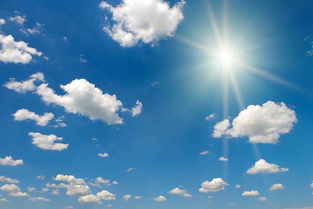 istock Bright midday sun and beautiful blue sky with clouds. 2222934811