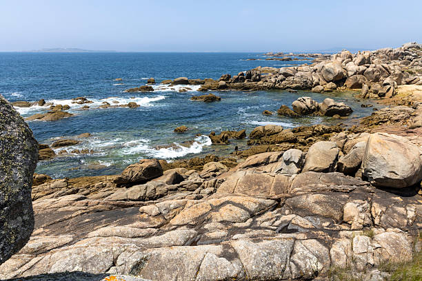 istock A rocky shoreline with a small boat in the water 2222935552
