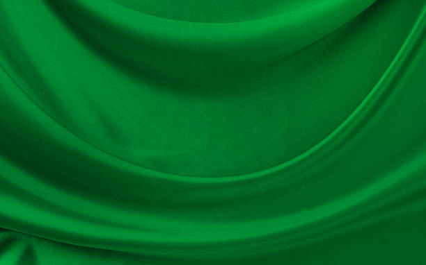 istock Black green satin dark fabric texture luxurious shiny that is abstract silk cloth background with patterns soft waves blur beautiful. 2222939355