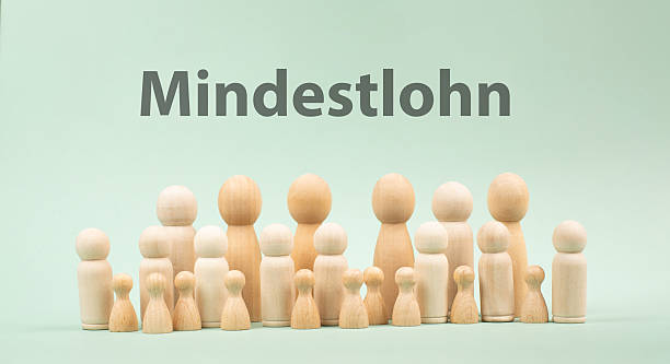istock Minimum wage, Mindestlohn in german language, high living costs, workers and employees need higher income, inflation, expensive food and housing, social issue 2222940352