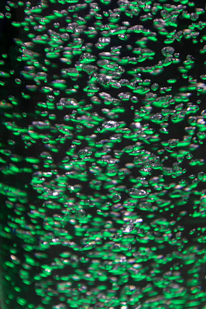 Image of many bubbles in colorful water.