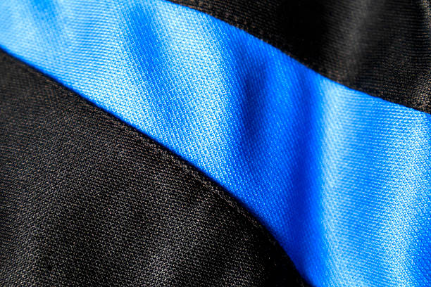 The black and blue fabric has wrinkles and the texture is rough.